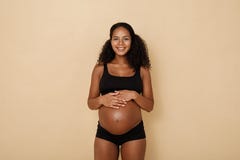 Happy pregnant woman in studio royalty free stock images Happy pregnant woman in studio royalty free stock images