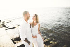 Happy romantic fashion couple in love have fun on beautiful sea at summer day Royalty Free Stock Image Happy romantic fashion couple in love have fun on beautiful sea at summer day Royalty Free Stock Image