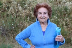 Happy senior woman hiking in the woods stock photography Happy senior woman hiking in the woods stock photography