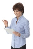 Happy senior woman using tablet computer royalty free stock photography Happy senior woman using tablet computer royalty free stock photography