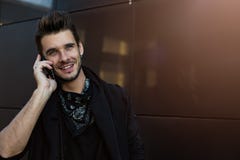 Joyful beard stylish man phoning via smartphone royalty free stock photo Joyful beard stylish man phoning via smartphone royalty free stock photo