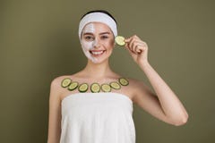 Happy smiling girl with white cosmetic mask on her face royalty free stock photo Happy smiling girl with white cosmetic mask on her face royalty free stock photo