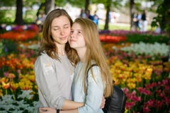 Happy Smiling Mother And Teen Daughter In A Park Stock Photo