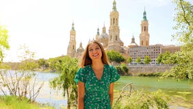Happy smiling tourist woman in green dress visiting Zaragoza, Spain stock image Happy smiling tourist woman in green dress visiting Zaragoza, Spain stock image