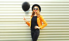 happy smiling woman holding black helium air balloon posing stock photos happy smiling woman holding black helium air balloon posing stock photos