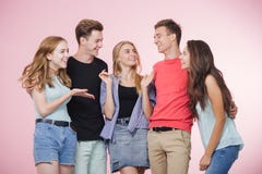 Happy smiling young group of friends standing together talking and laughing. Best friends royalty free stock images Happy smiling young group of friends standing together talking and laughing. Best friends royalty free stock images