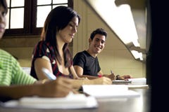 Happy student studying and writing Stock Photography Happy student studying and writing Stock Photography