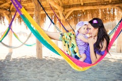 Happy Stylish Family With Cute Daughter Relaxing In Hammock On Summer Vacation In Evening Sun Light On The Beach. Hipster Couple W Royalty Free Stock Image Happy Stylish Family With Cute Daughter Relaxing In Hammock On Summer Vacation In Evening Sun Light On The Beach. Hipster Couple W Royalty Free Stock Image