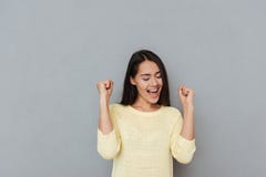 Happy successful young woman shouting and celebrating success stock photo Happy successful young woman shouting and celebrating success stock photo