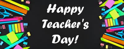Happy Teachers Day. School supplies on blackboard background ready for your design. Flat lay. Top view.