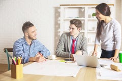 Happy team working on project stock images Happy team working on project stock images