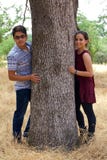 Happy Teenage Couple in a Park stock photo Happy Teenage Couple in a Park stock photo