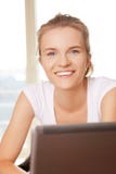 Happy teenage girl with laptop computer Royalty Free Stock Images Happy teenage girl with laptop computer Royalty Free Stock Images