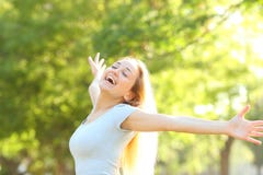 Happy teenage girl stretching arms in a park royalty free stock image Happy teenage girl stretching arms in a park royalty free stock image