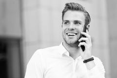 Happy to hear you. Man well groomed speak mobile phone urban background. Businessman cheerful call friend. Friendly royalty free stock photos Happy to hear you. Man well groomed speak mobile phone urban background. Businessman cheerful call friend. Friendly royalty free stock photos