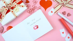 Happy Valentine`s Day overhead flat lay writing card.