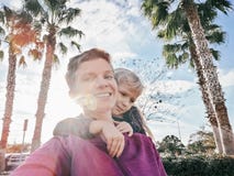 Happy white Caucasian mother and daughter girl making selfie on phone camera outside stock photos Happy white Caucasian mother and daughter girl making selfie on phone camera outside stock photos