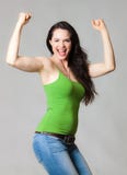 Happy woman flexing muscles royalty free stock images Happy woman flexing muscles royalty free stock images