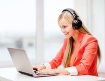 Happy woman with headphones listening to music