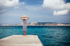 Happy woman relaxing on pier in Sardinia island, Italy royalty free stock images Happy woman relaxing on pier in Sardinia island, Italy royalty free stock images