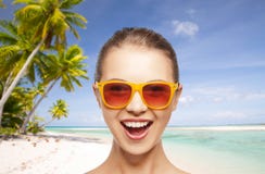 Happy woman or teenage girl in sunglasses on beach stock photography Happy woman or teenage girl in sunglasses on beach stock photography