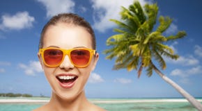 Happy woman or teenage girl in sunglasses on beach stock images Happy woman or teenage girl in sunglasses on beach stock images