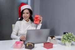 happy woman wear santa hat and christmas gift with labtop computer stock photography happy woman wear santa hat and christmas gift with labtop computer stock photography