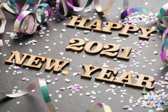 Happy year 2021 - Letters in wood. Black background