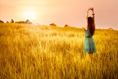 Happy young asian woman standing in meadows stock photos Happy young asian woman standing in meadows stock photos
