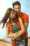 Happy young casual couple embracing outdoors Royalty Free Stock Images Happy young casual couple embracing outdoors Royalty Free Stock Images