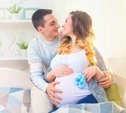 Happy young couple expecting baby stock photos Happy young couple expecting baby stock photos