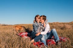 Happy young couple hugging and laughing outdoors. royalty free stock photography Happy young couple hugging and laughing outdoors. royalty free stock photography