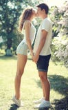 Happy young couple in love, sensual kiss at sunny warm spring royalty free stock photo Happy young couple in love, sensual kiss at sunny warm spring royalty free stock photo