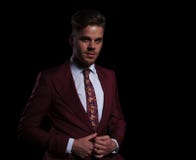 Happy young elegant businessman buttoning his coat stock images Happy young elegant businessman buttoning his coat stock images