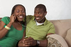 Happy young ethnic black couple listening music stock photos Happy young ethnic black couple listening music stock photos