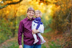 Happy young father having fun cute toddler daughter, family portrait together. man with beautiful baby girl in nature royalty free stock photo Happy young father having fun cute toddler daughter, family portrait together. man with beautiful baby girl in nature royalty free stock photo