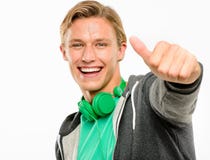 Happy young man holding thumbs up smiling isolated on white back royalty free stock images Happy young man holding thumbs up smiling isolated on white back royalty free stock images