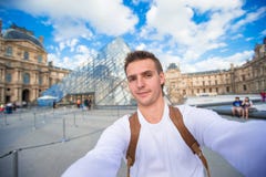 Happy young man taking a selfie photo in Paris stock photo Happy young man taking a selfie photo in Paris stock photo
