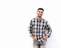 Happy young north african man smiling against white background stock photos Happy young north african man smiling against white background stock photos