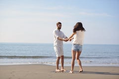 Happy young romantic couple in love have fun on beautiful beach at beautiful summer day. Stock Photography Happy young romantic couple in love have fun on beautiful beach at beautiful summer day. Stock Photography