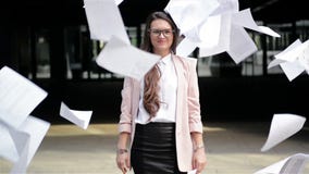 Happy Young Successful Manager Throwing Up Her Documents. Business Lady Is Celebrating Leave From Job. stock video footage Happy Young Successful Manager Throwing Up Her Documents. Business Lady Is Celebrating Leave From Job. stock video footage