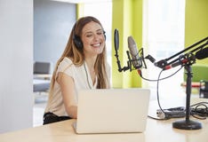 Happy young woman broadcasting in a studio, close up royalty free stock photos Happy young woman broadcasting in a studio, close up royalty free stock photos