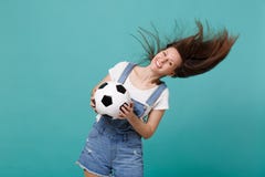 Happy young woman football fan with fluttering hair cheer up support favorite team with soccer ball isolated on blue royalty free stock photography Happy young woman football fan with fluttering hair cheer up support favorite team with soccer ball isolated on blue royalty free stock photography