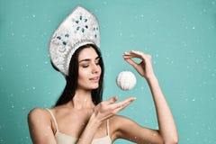 Happy young woman holding Christmas ball royalty free stock image Happy young woman holding Christmas ball royalty free stock image