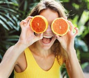 Happy young woman with oranges royalty free stock image Happy young woman with oranges royalty free stock image