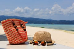 hat-bag-sun-glasses-flip-flops-tropical-beach-vacation-concept-40881811.jpg