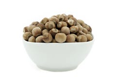 Hazelnuts In A White Dish, Front View Royalty Free Stock Image