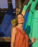 Head and shoulders portrait of young beautiful and happy blond woman smiling relaxed and cheerful posing with colorful surf boards royalty free stock photo Head and shoulders portrait of young beautiful and happy blond woman smiling relaxed and cheerful posing with colorful surf boards royalty free stock photo