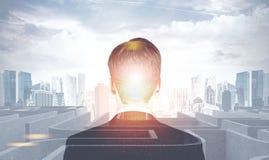 Businessman looking at labyrinth in a city Stock Photography Businessman looking at labyrinth in a city Stock Photography