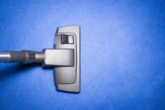 Head of Vacuum cleaner on Blue carpet stock image Head of Vacuum cleaner on Blue carpet stock image